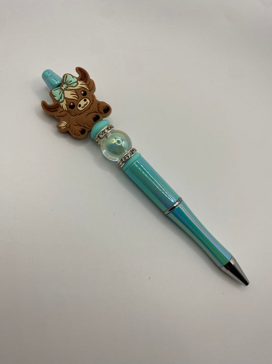 Cow with turquoise bow